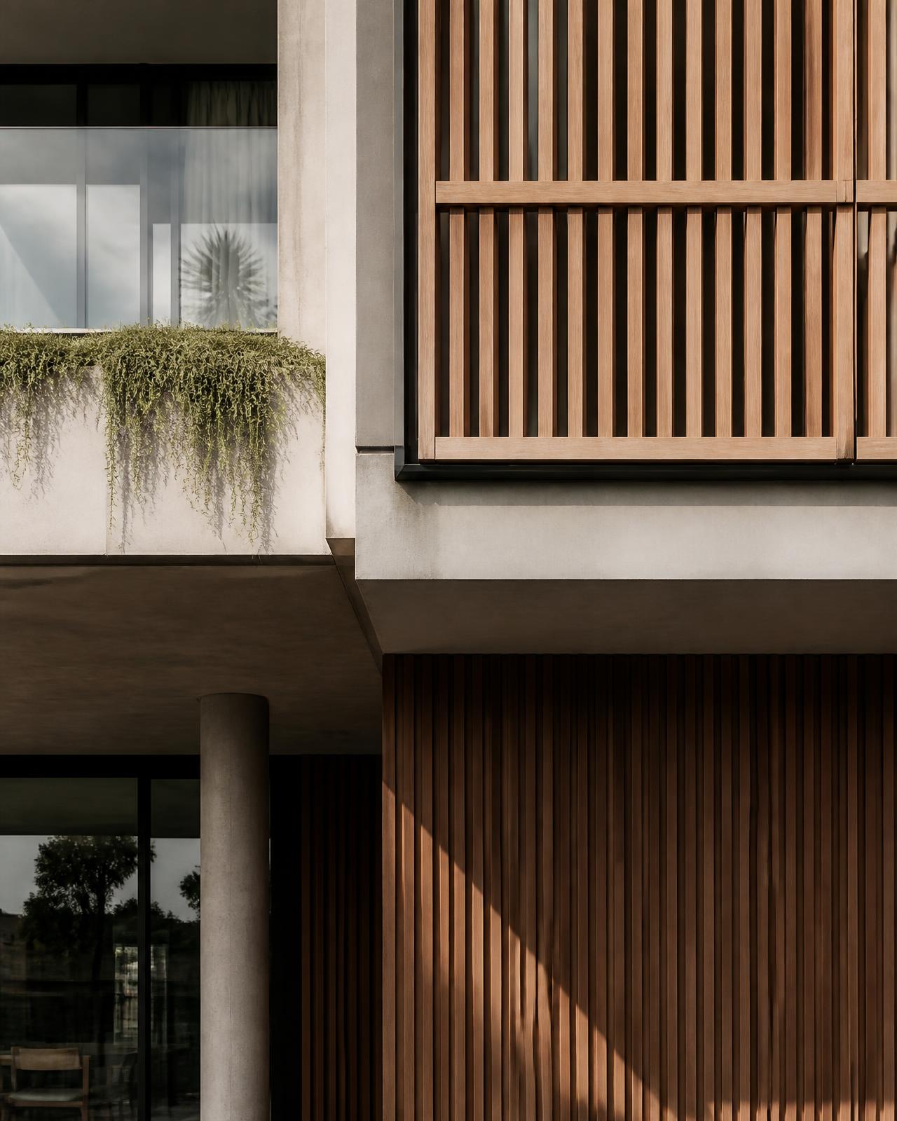 Architectural detail of a contemporary mixed-use development facade with timber screening and concrete