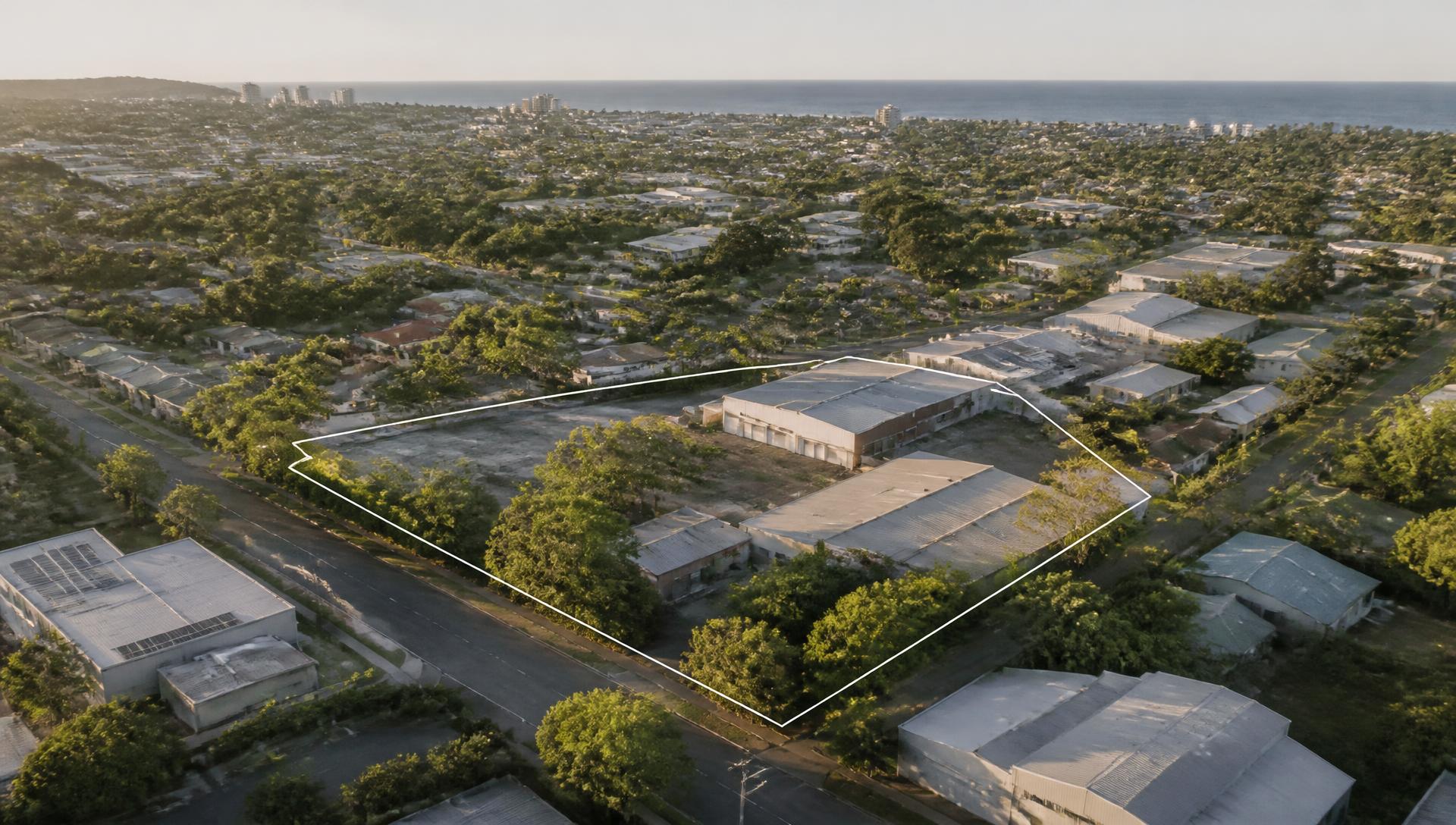 Aerial view of a strategic development landholding in South East Queensland with the coastline beyond